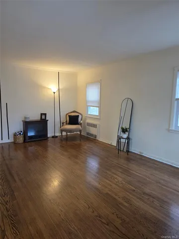 a view of a livingroom with furniture and wooden floor