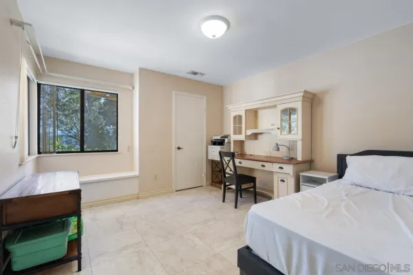 a hotel room with a bed and a window
