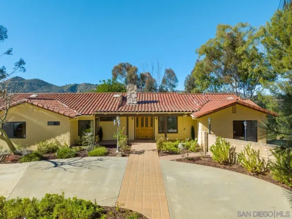 a front view of a house with a patio