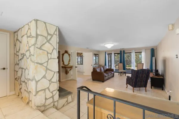 a view of living room with furniture and window
