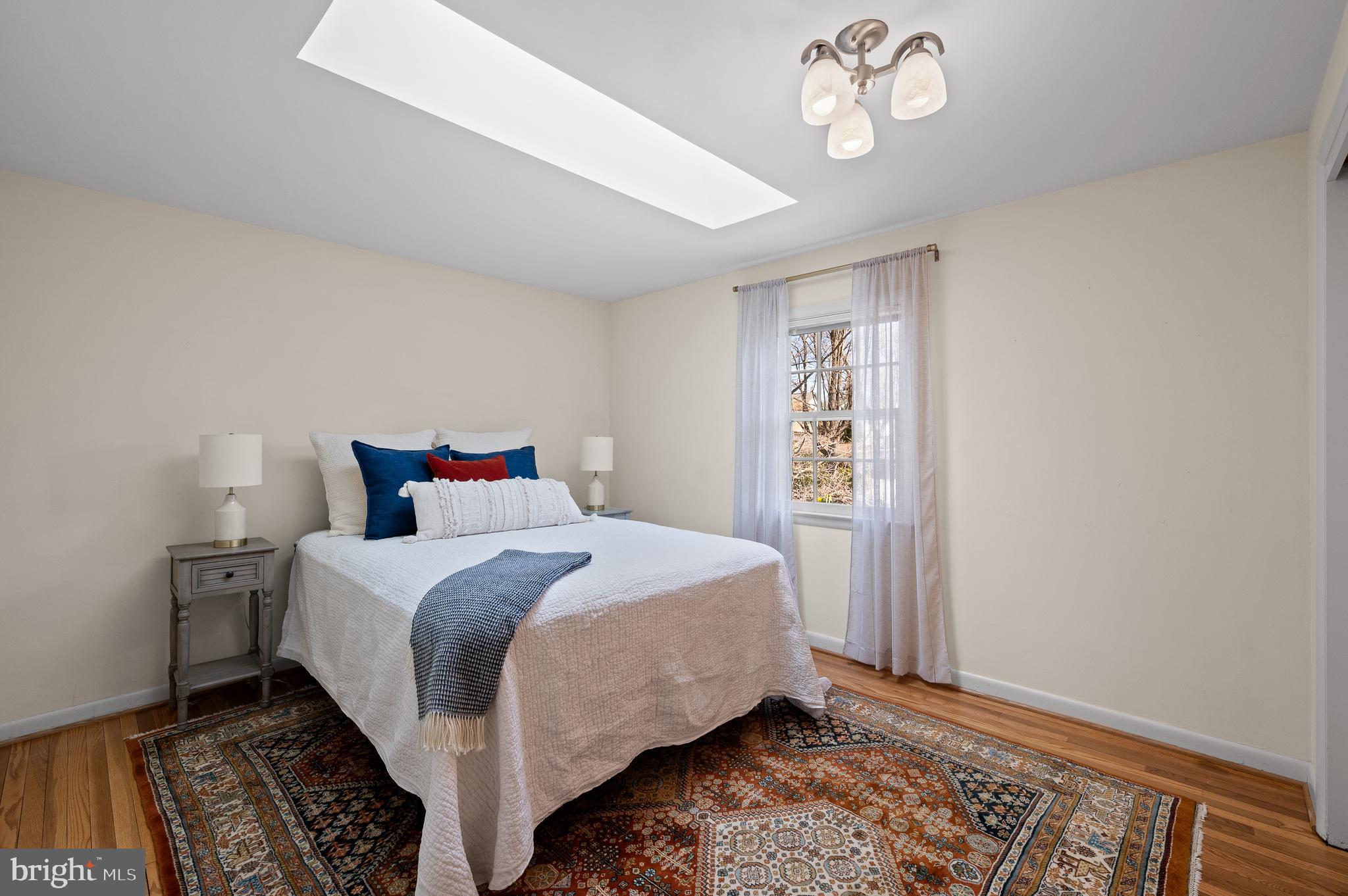 284 West Valley Road Wayne, PA 19087 - Photo 22 of 35 a bedroom with bed and wooden floor