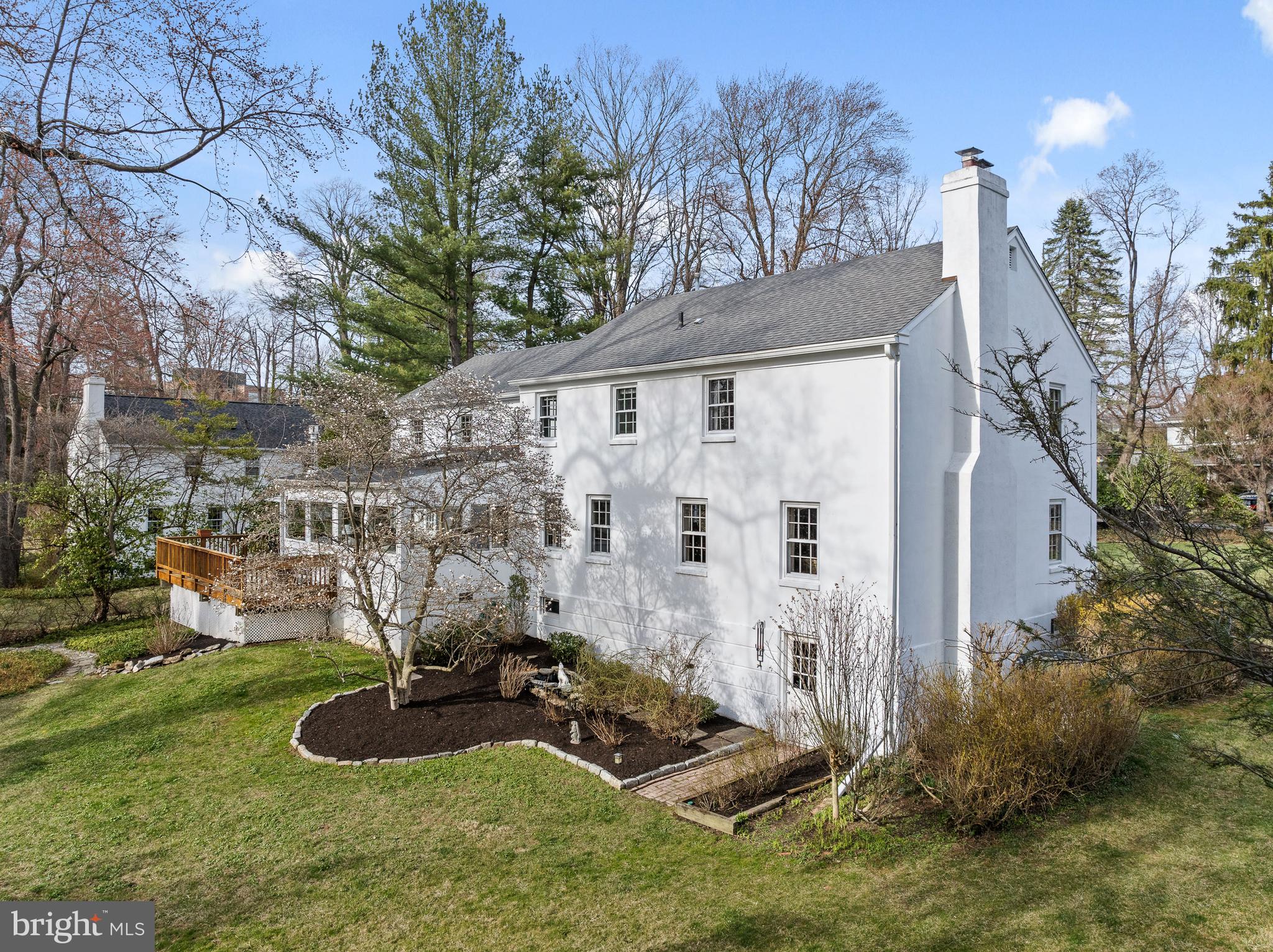 284 West Valley Road Wayne, PA 19087 - Photo 32 of 35 a view of a backyard with plants and a large tree