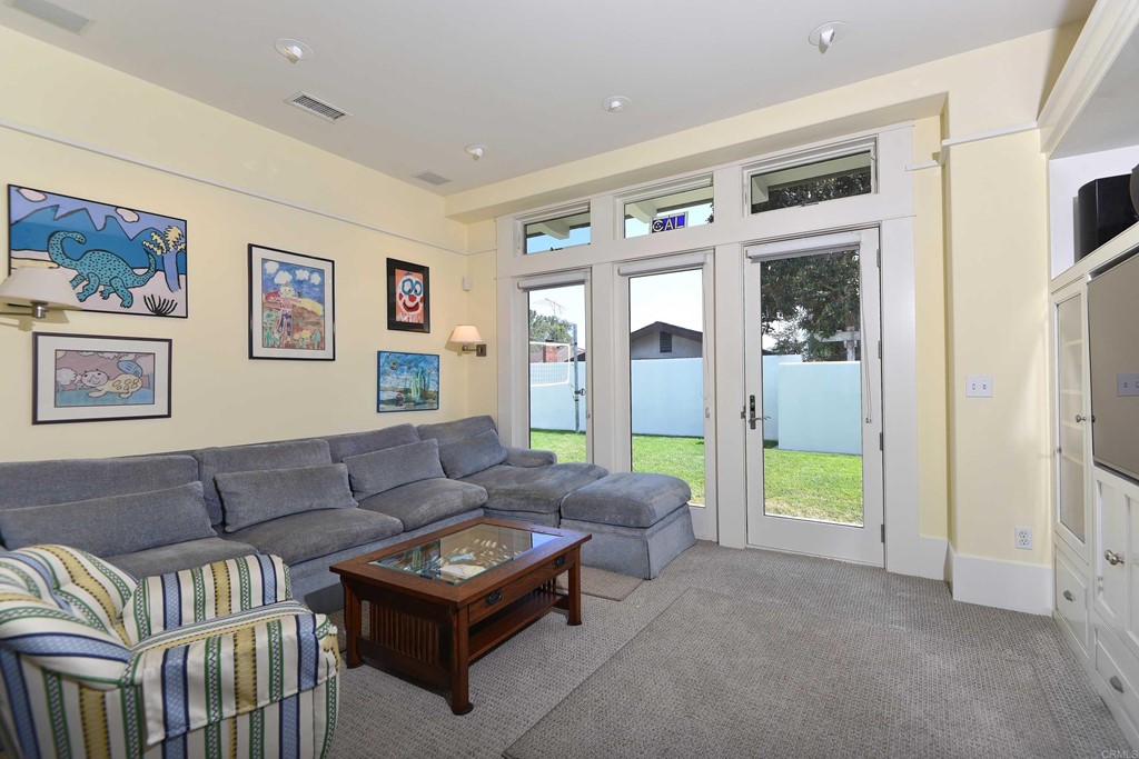 441 Oceanview Terrace Encinitas, CA 92024 - Photo 11 of 34 a living room with furniture and a open kitchen view
