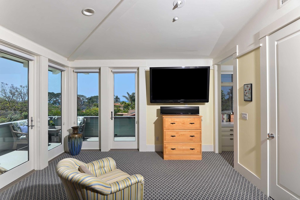441 Oceanview Terrace Encinitas, CA 92024 - Photo 17 of 34 a living room with furniture and a flat screen tv