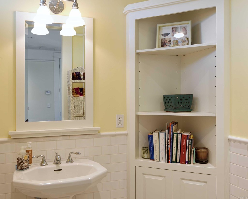 441 Oceanview Terrace Encinitas, CA 92024 - Photo 24 of 34 a bathroom with a sink and a mirror