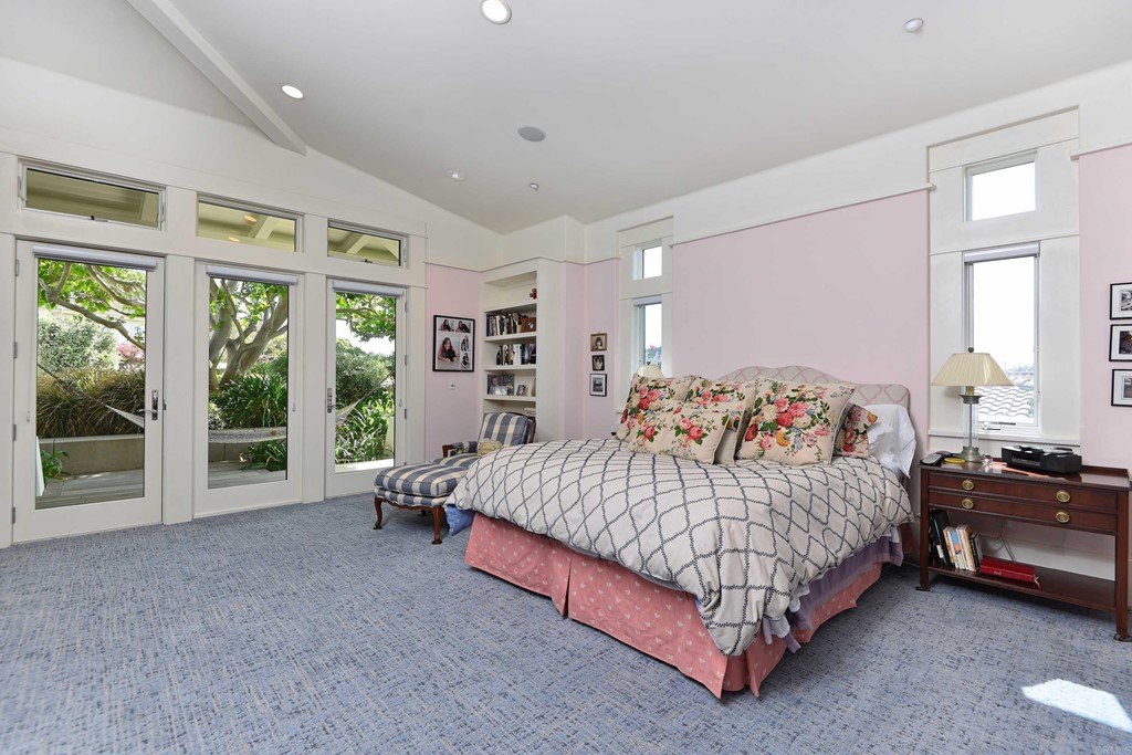 441 Oceanview Terrace Encinitas, CA 92024 - Photo 8 of 34 a bedroom with a bed lamp and a large window