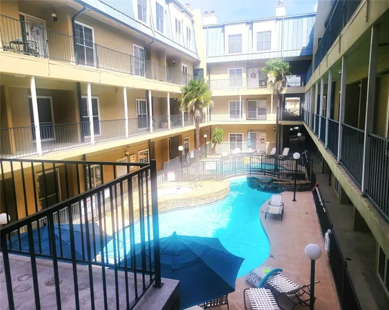 a view of a balcony with chairs