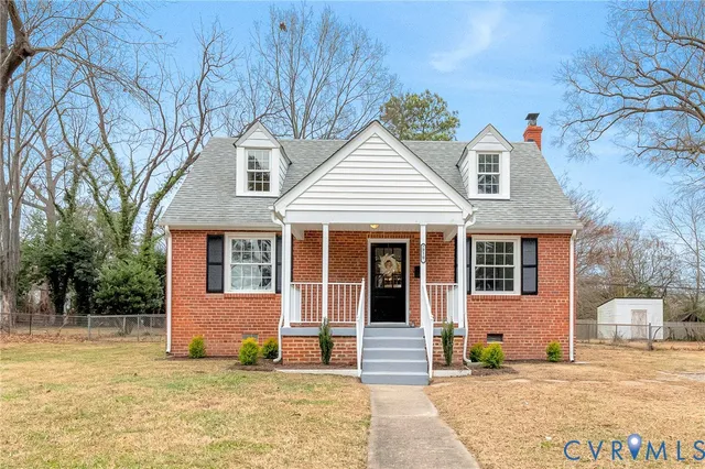 a front view of a house with a patio
