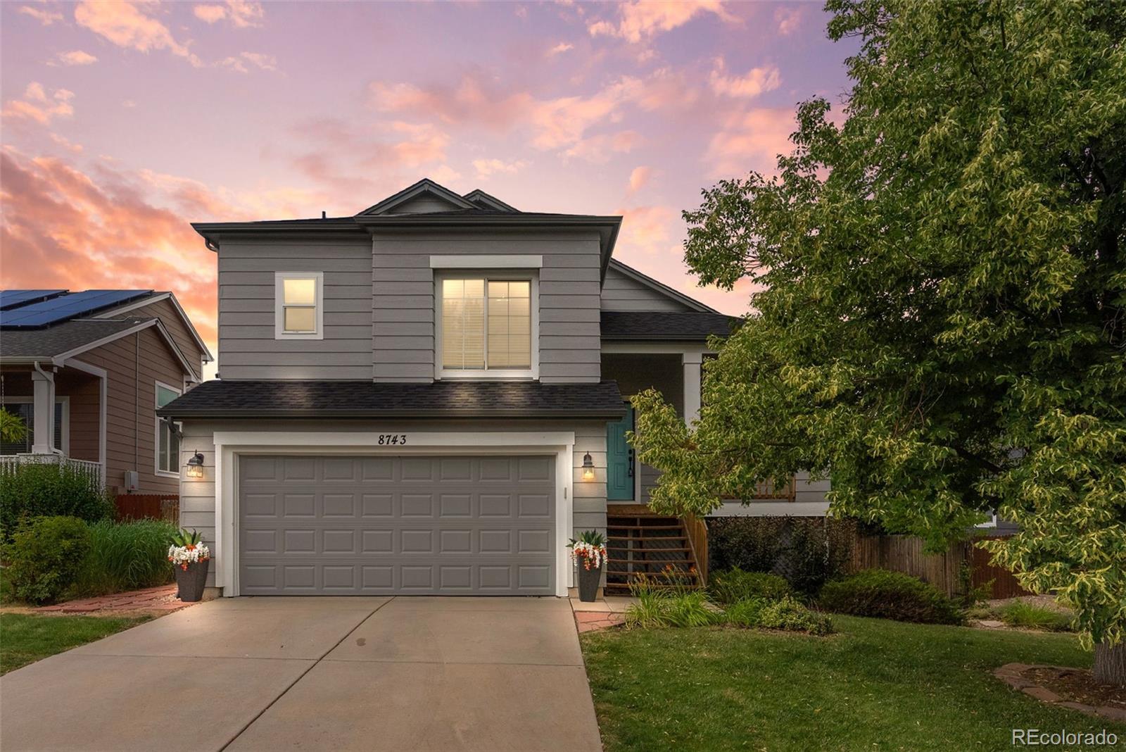 a front view of a house with a garage