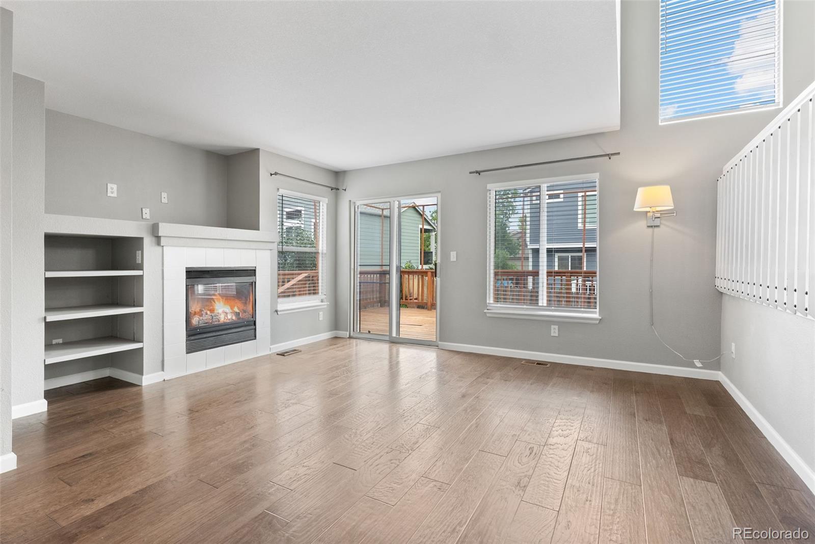 8743 Wildrye Circle Parker, CO 80134 - Photo 11 of 35 a view of an empty room with a window and fireplace