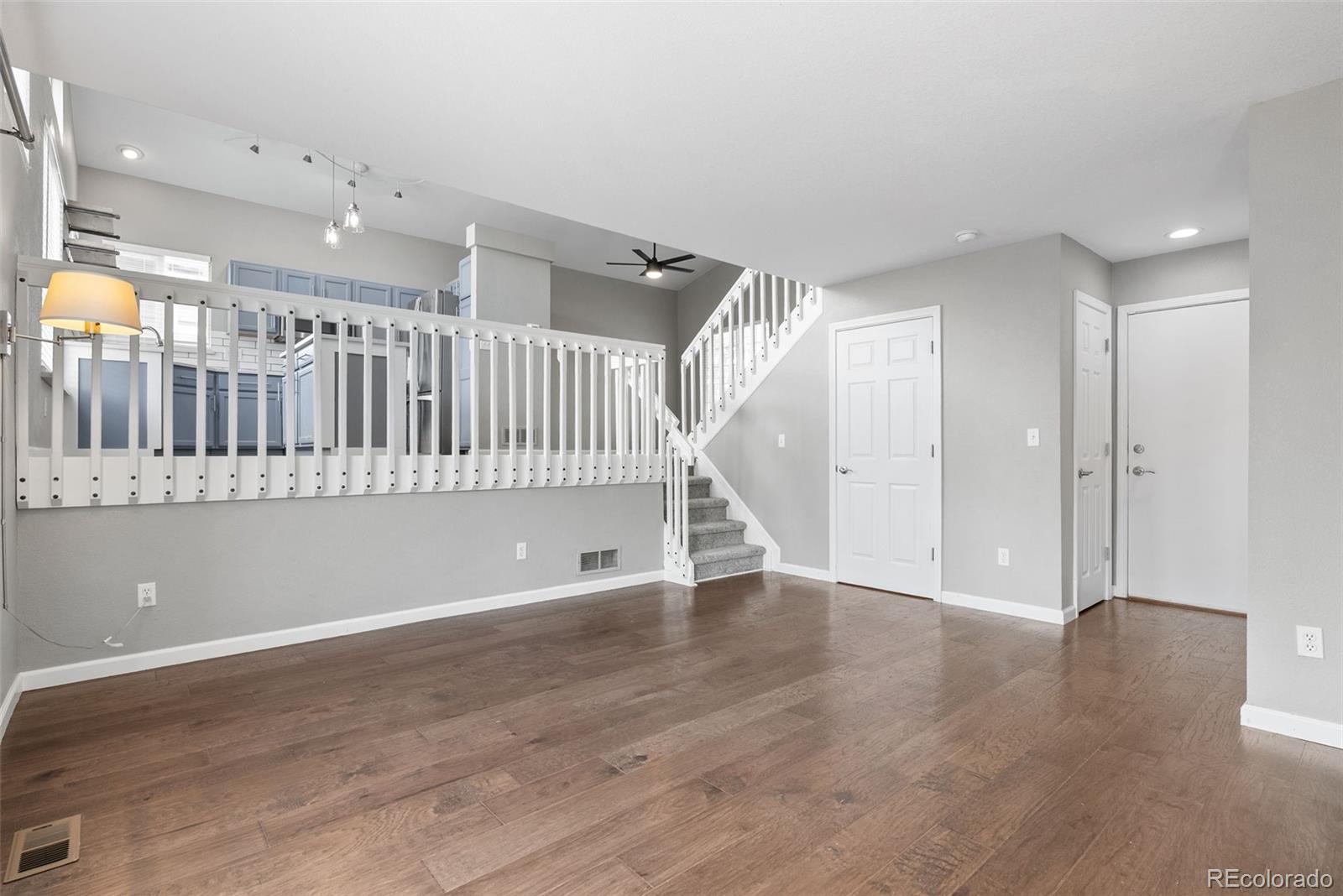 8743 Wildrye Circle Parker, CO 80134 - Photo 12 of 35 a view of an entryway with wooden floor