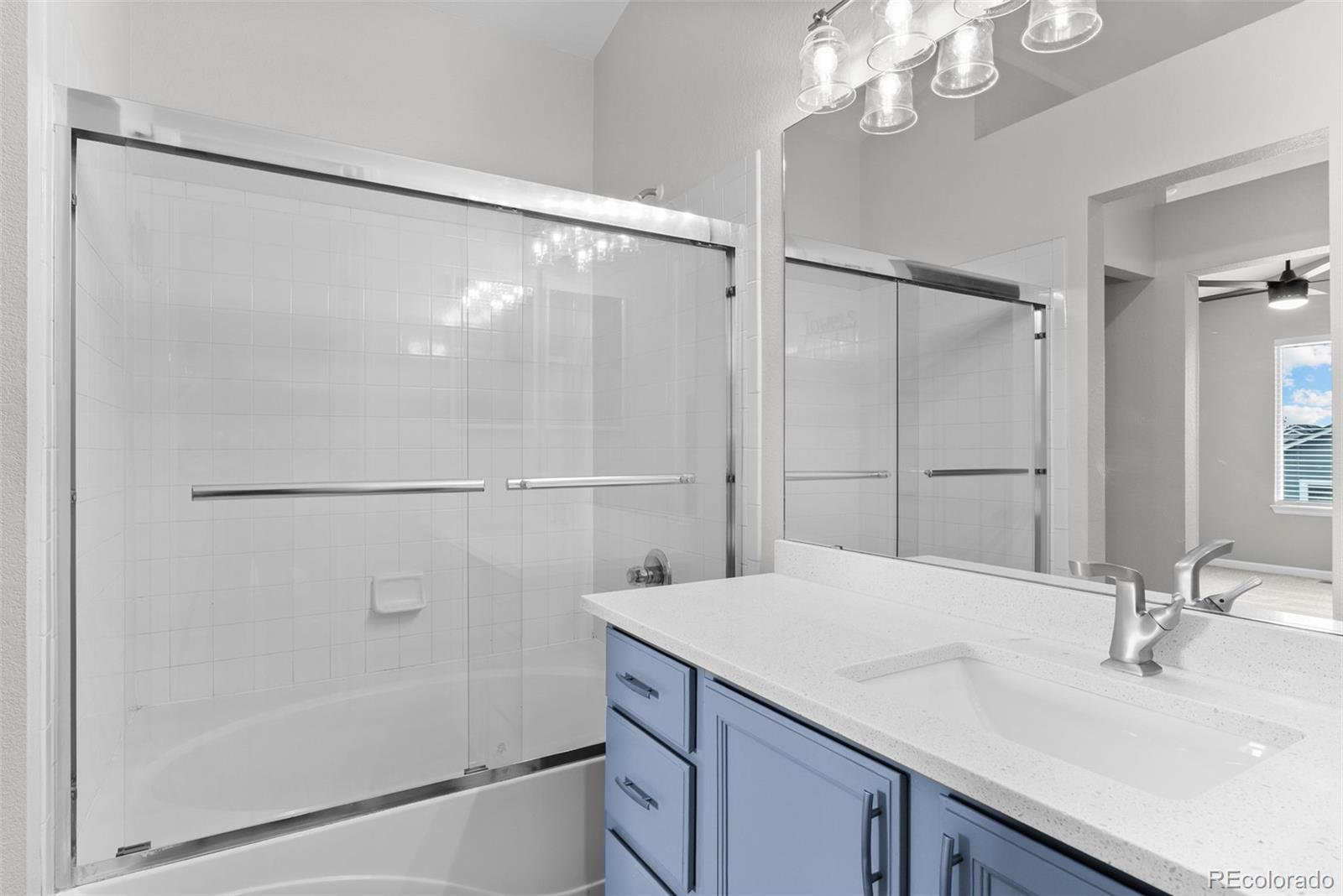 8743 Wildrye Circle Parker, CO 80134 - Photo 17 of 35 a bathroom with a sink and a mirror