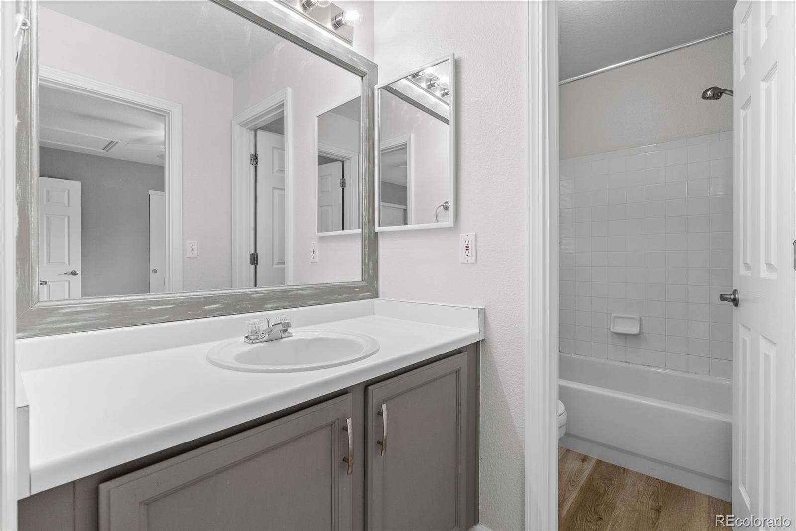 8743 Wildrye Circle Parker, CO 80134 - Photo 19 of 35 a bathroom with a sink and a mirror