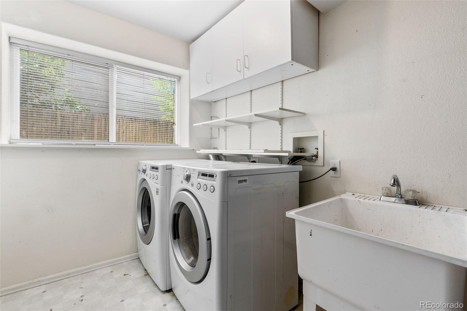 8743 Wildrye Circle Parker, CO 80134 - Photo 23 of 35 a utility room with dryer and washer