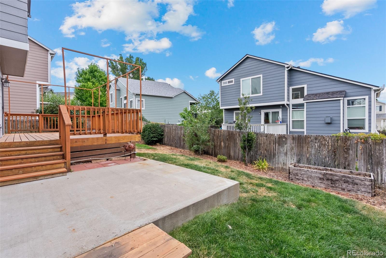 8743 Wildrye Circle Parker, CO 80134 - Photo 26 of 35 a view of a house with a yard and a garden