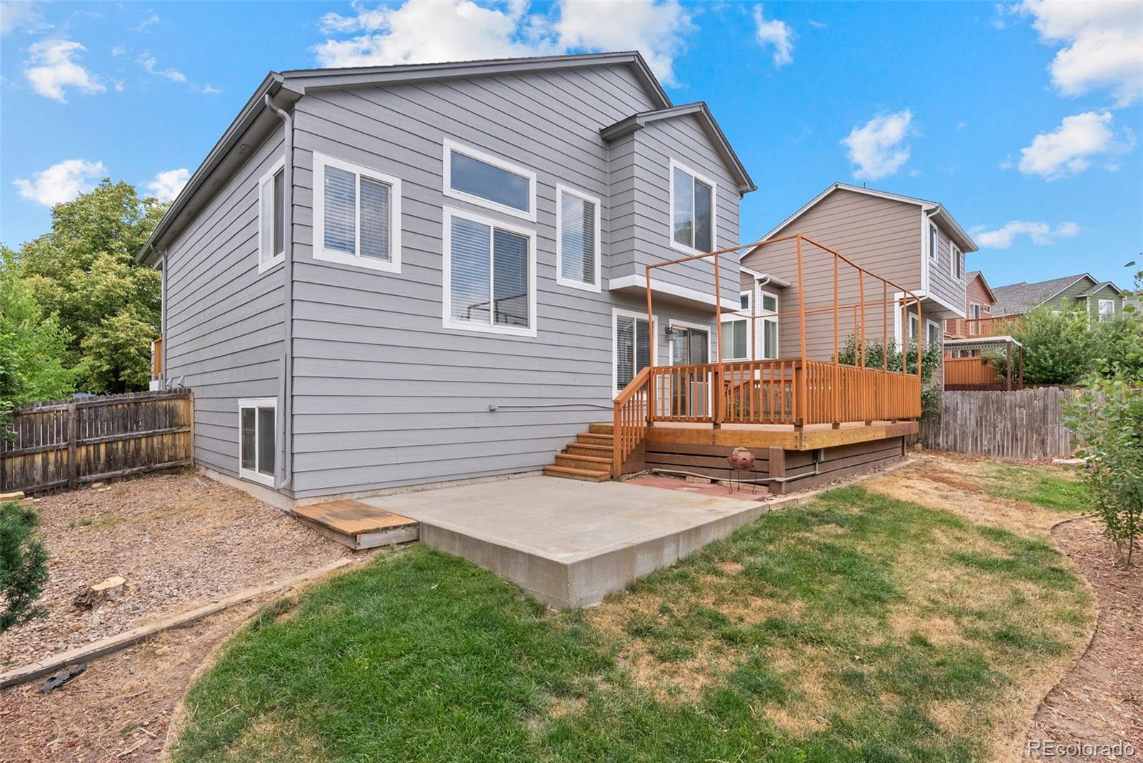 8743 Wildrye Circle Parker, CO 80134 - Photo 27 of 35 a view of backyard with a garden and deck