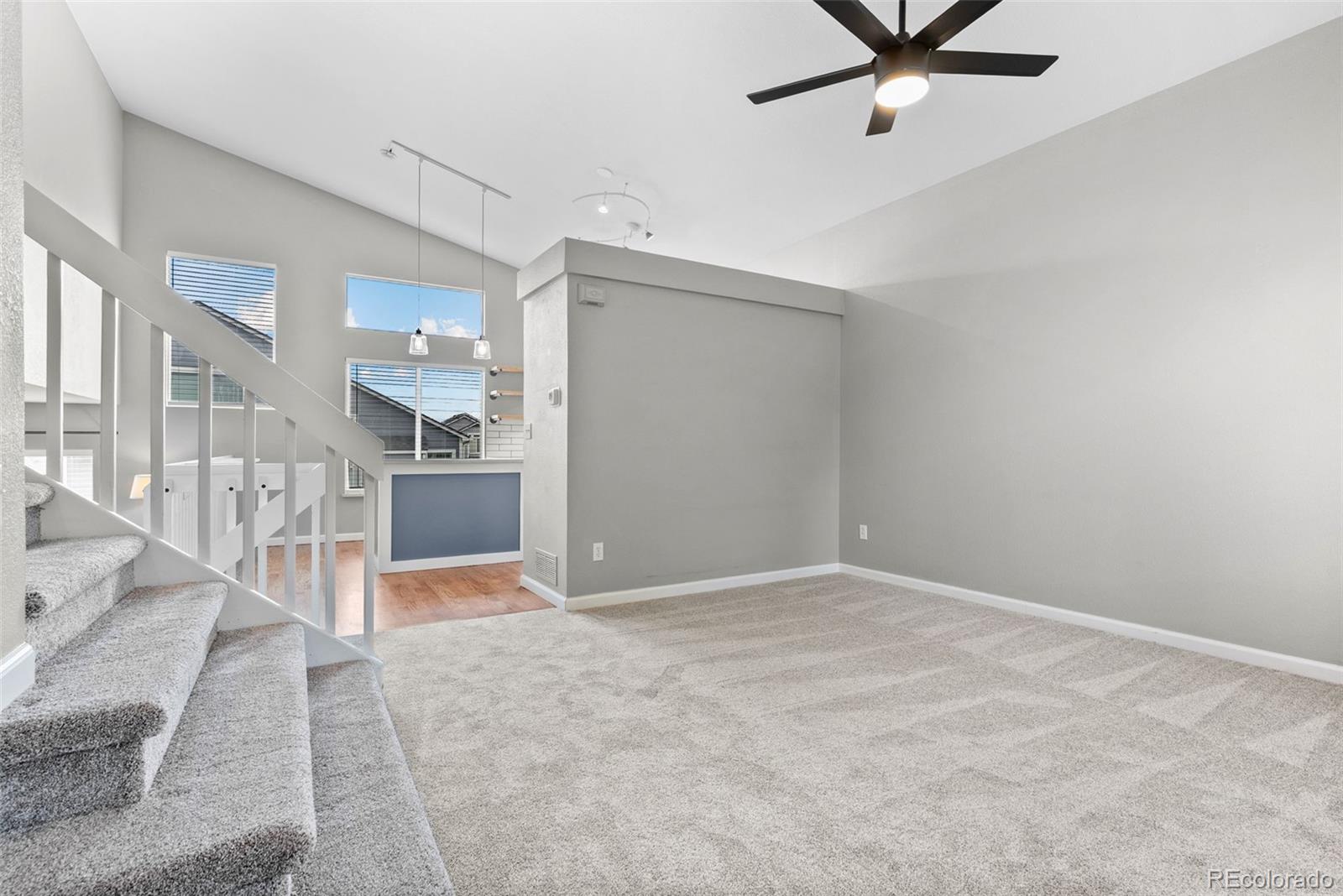8743 Wildrye Circle Parker, CO 80134 - Photo 3 of 35 an empty room with a kitchen space and a sink