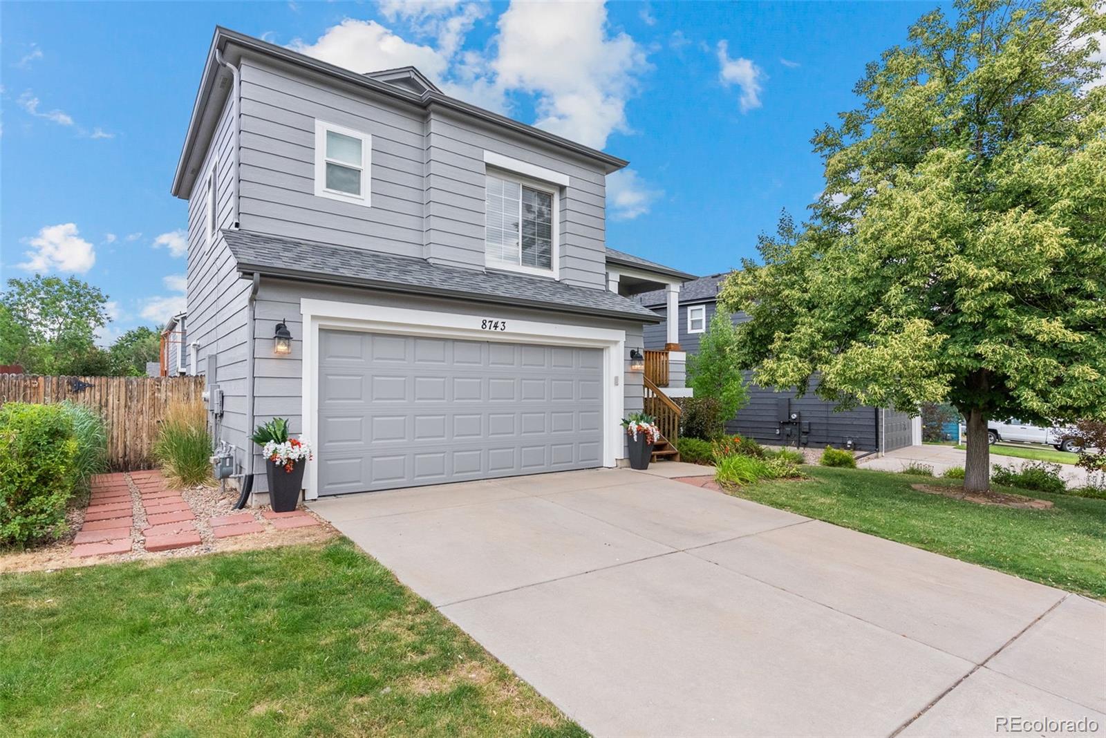 8743 Wildrye Circle Parker, CO 80134 - Photo 33 of 35 a front view of a house with a yard and garage