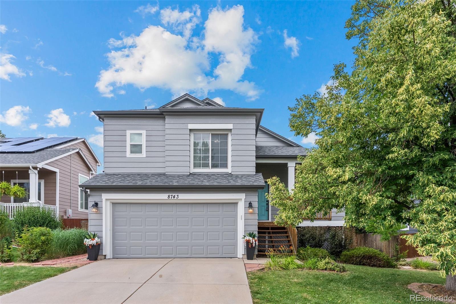8743 Wildrye Circle Parker, CO 80134 - Photo 35 of 35 a front view of a house with a yard and garage