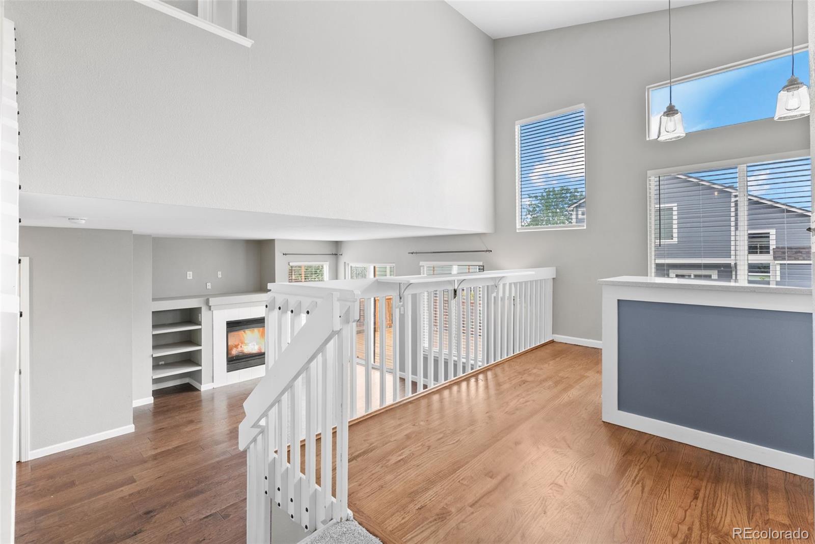 8743 Wildrye Circle Parker, CO 80134 - Photo 10 of 35 a view of a kitchen with furniture and wooden floor