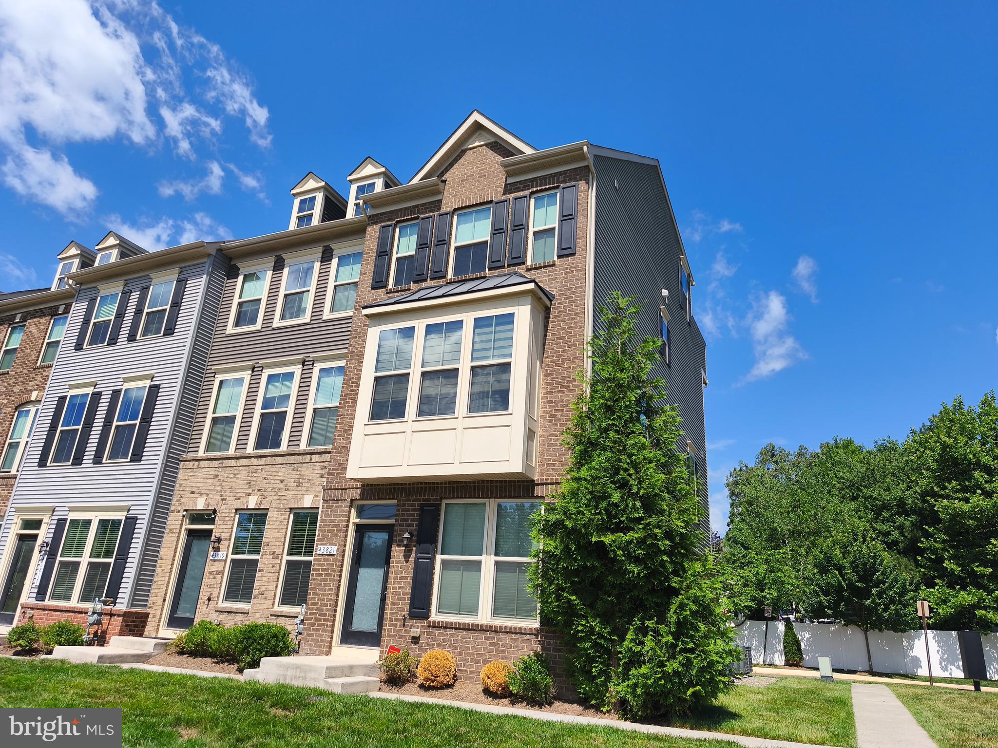 a front view of a building with garden
