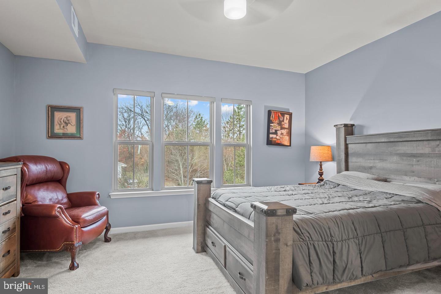 43821 Stubble Cor Square Ashburn, VA 20147 - Photo 13 of 25 a bedroom with a bed and wooden floor