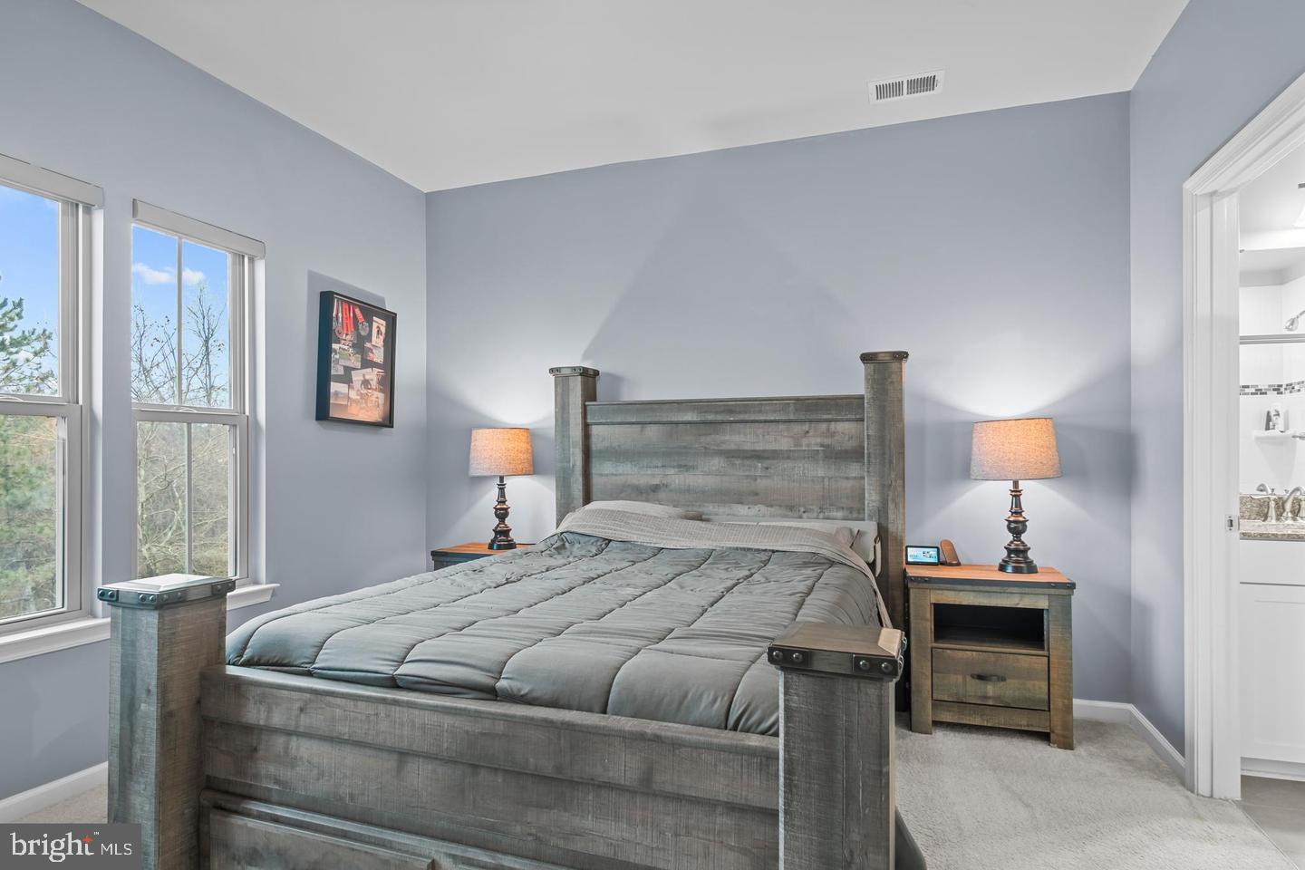 43821 Stubble Cor Square Ashburn, VA 20147 - Photo 14 of 25 a bedroom with a bed and wooden floor