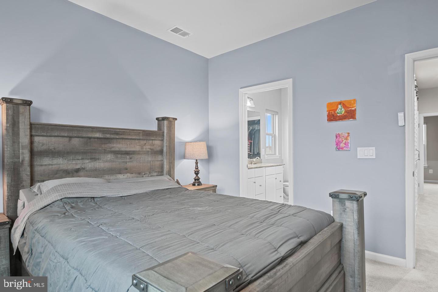 43821 Stubble Cor Square Ashburn, VA 20147 - Photo 15 of 25 a bedroom with a bed and a night stand