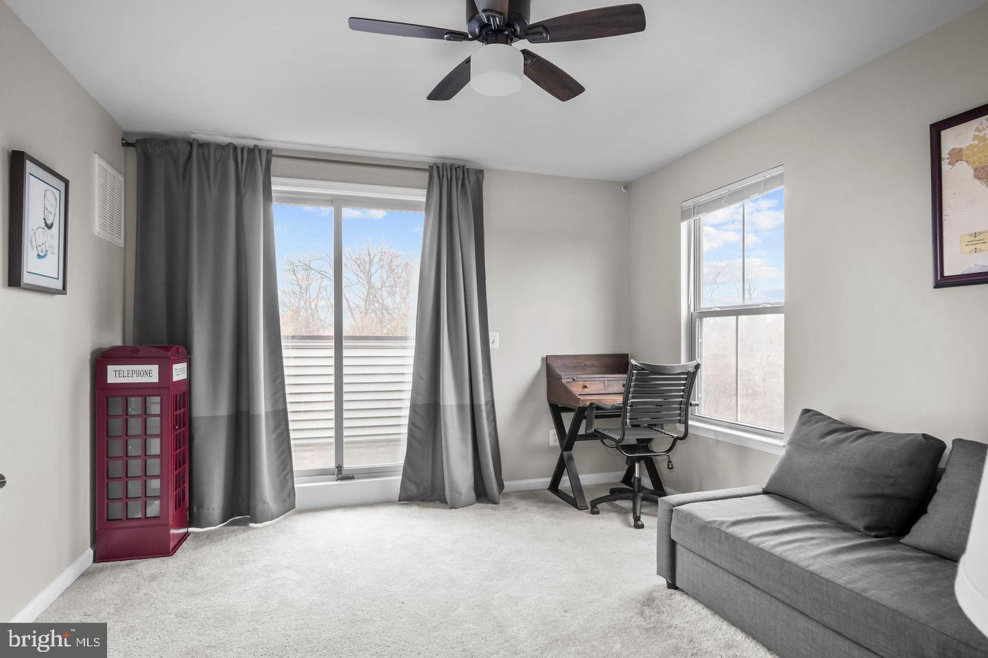 43821 Stubble Cor Square Ashburn, VA 20147 - Photo 22 of 25 a living room with furniture and a window