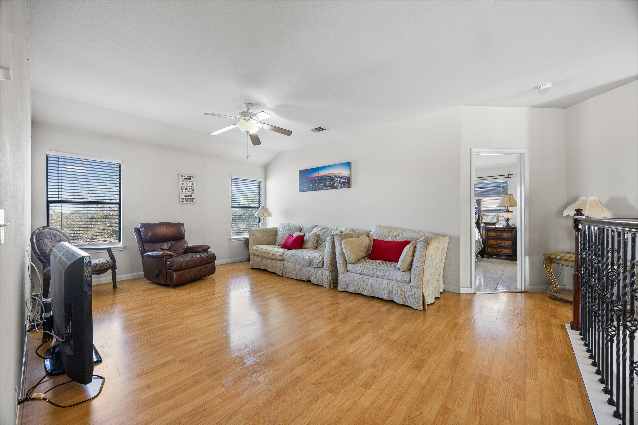 3502 Shiraz Loop Round Rock, TX 78665 - Photo 12 of 23 Living area featuring light wood finished floors and a ceiling fan