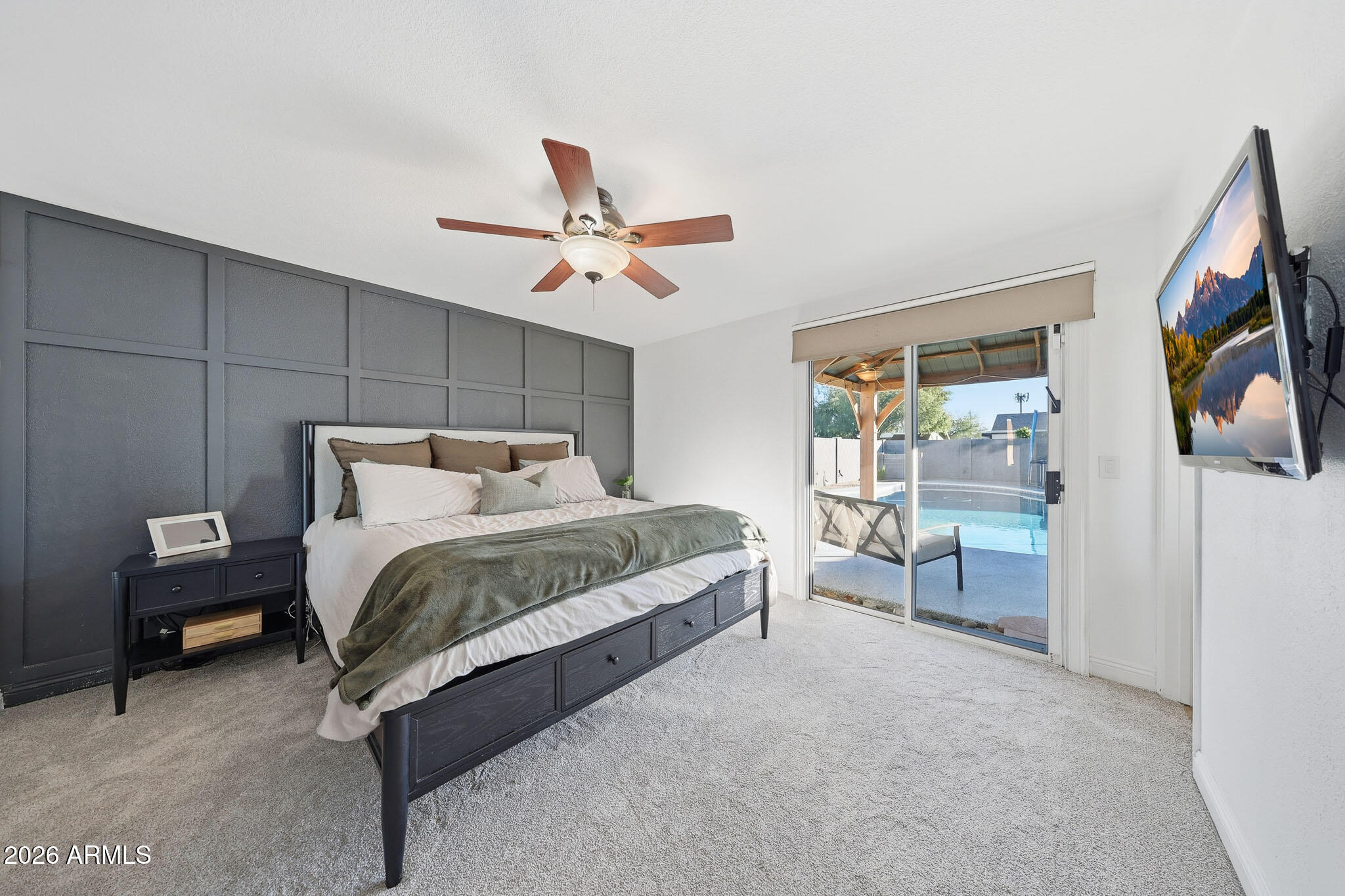 3317 East Bloomfield Road Phoenix, AZ 85032 - Photo 27 of 45 a bedroom with a bed and a chandelier