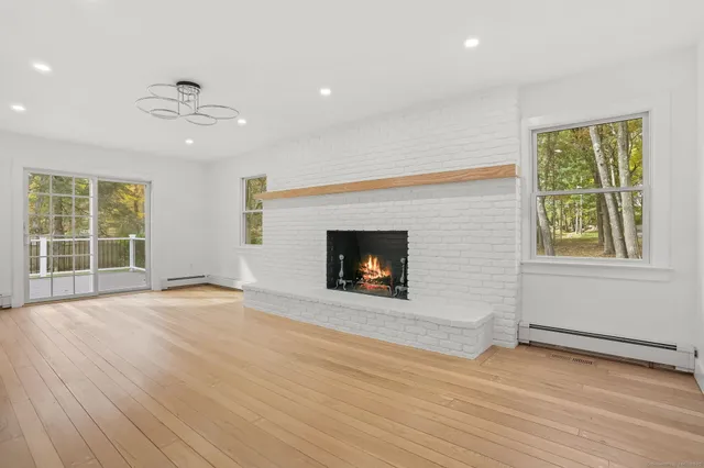 a kitchen with stainless steel appliances a refrigerator sink and cabinets