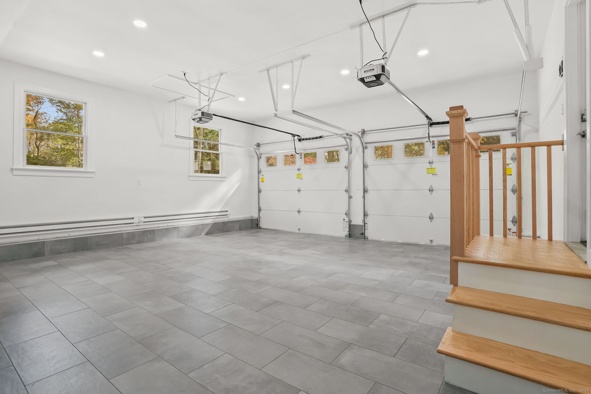 4 Trails End Road Weston, CT 06883 - Photo 13 of 40 a view of a livingroom with stairs and a ceiling fan