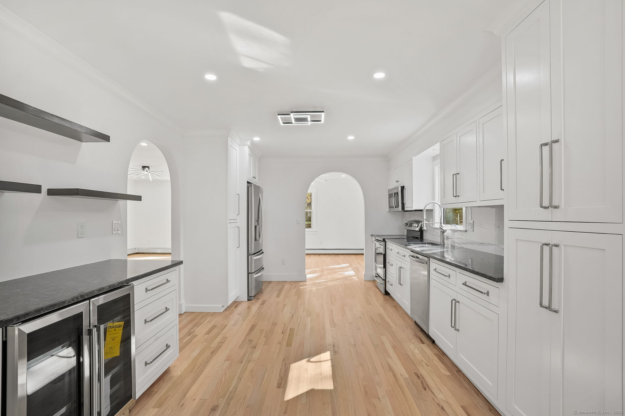 4 Trails End Road Weston, CT 06883 - Photo 14 of 40 a large kitchen with stainless steel appliances a large counter top a stove a sink and a refrigerator