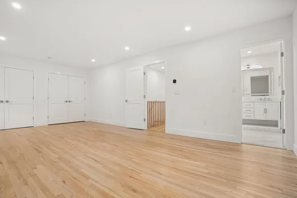 a view of a livingroom with stairs and a ceiling fan