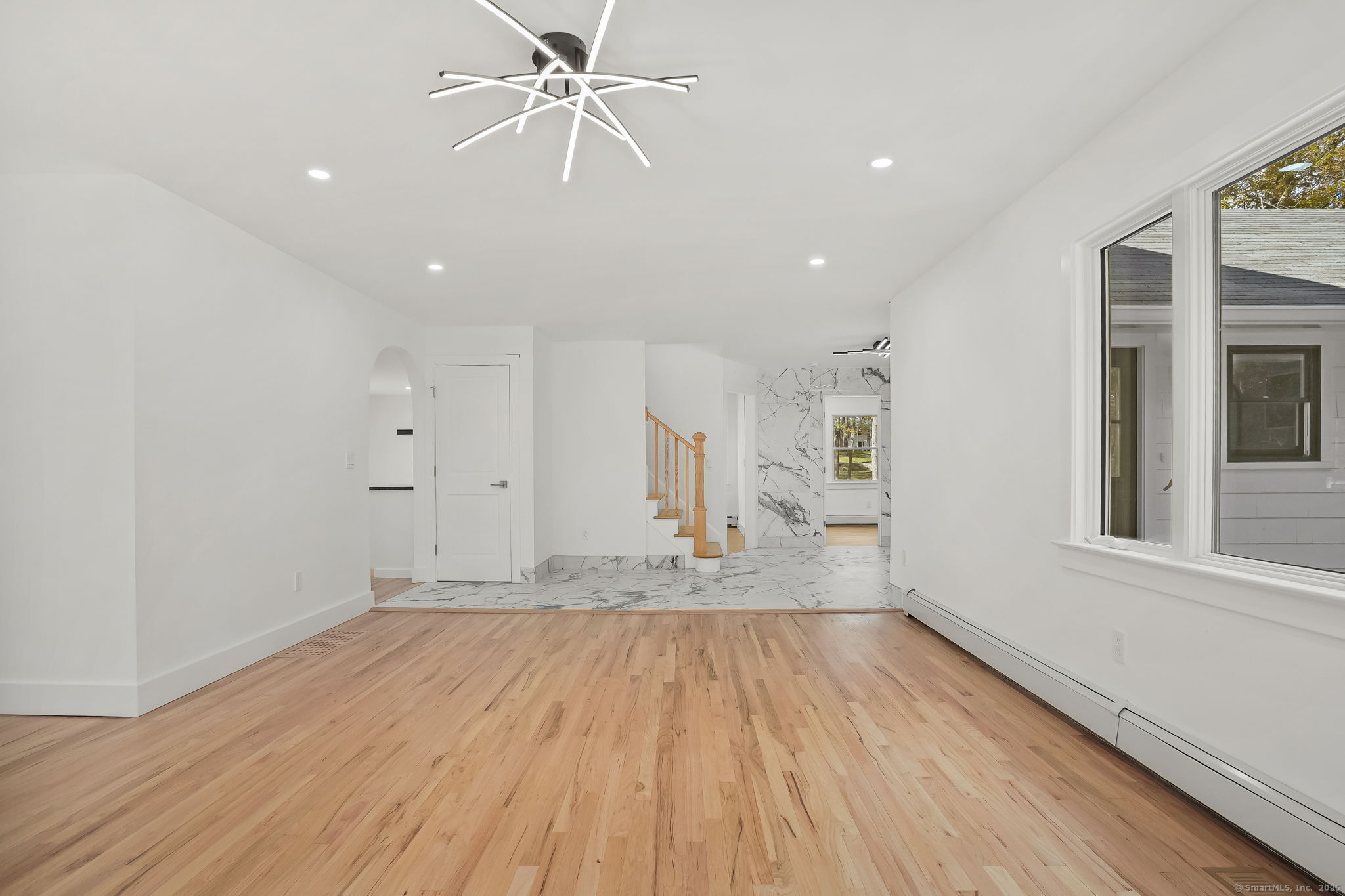 4 Trails End Road Weston, CT 06883 - Photo 26 of 40 a view of empty room with wooden floor and fan