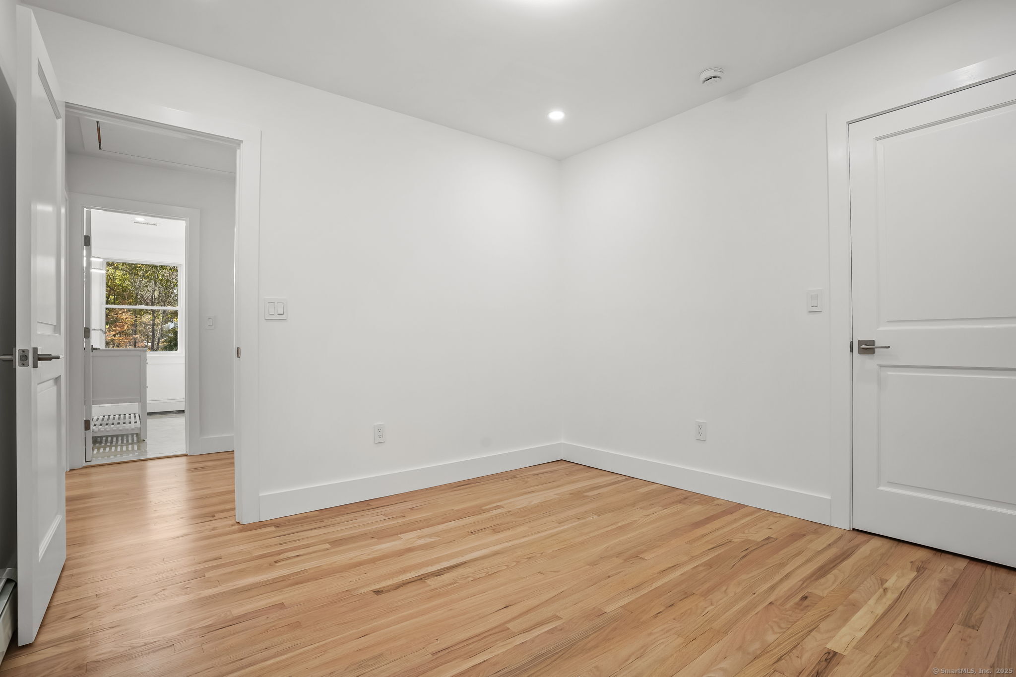 4 Trails End Road Weston, CT 06883 - Photo 28 of 40 wooden floor in an empty room with a window