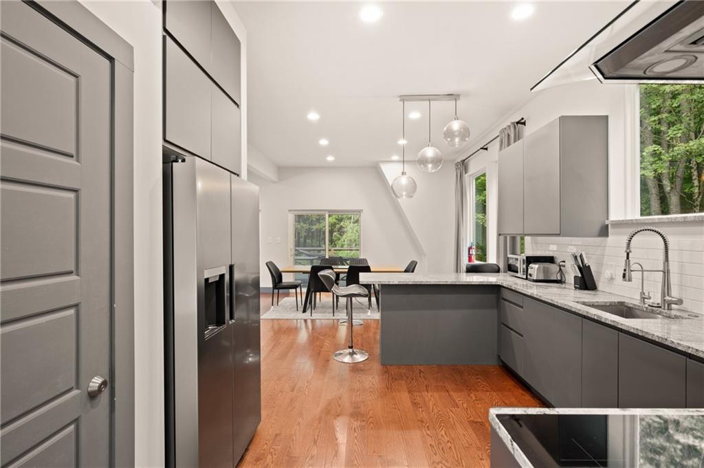 146 Luna Way Markleton, PA 15551 - Photo 18 of 50 a kitchen with lots of counter top space and living room