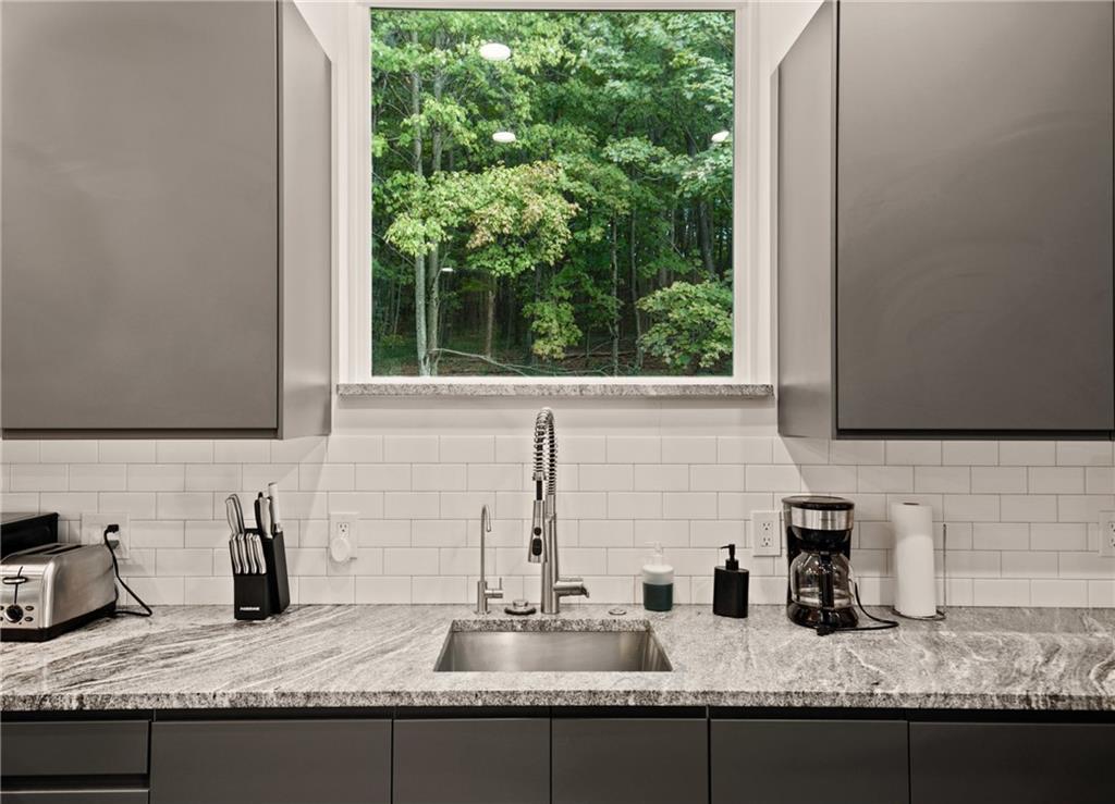 146 Luna Way Markleton, PA 15551 - Photo 19 of 50 a kitchen with granite countertop a sink and a window
