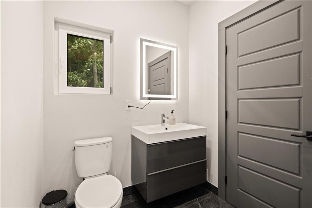 146 Luna Way Markleton, PA 15551 - Photo 22 of 50 a bathroom with a toilet sink and mirror