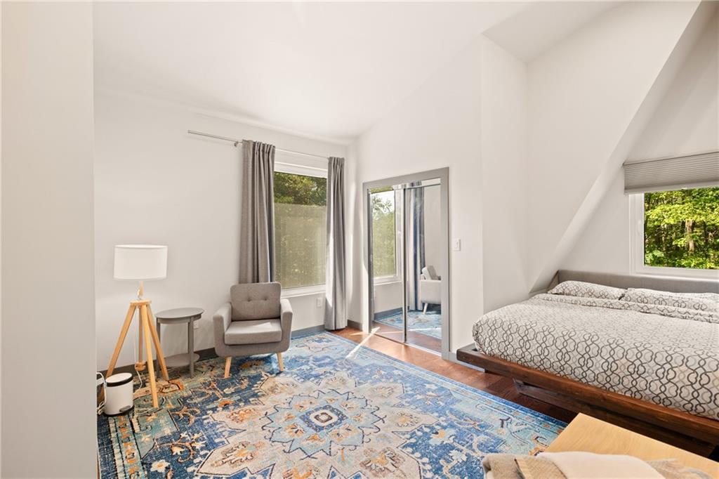 146 Luna Way Markleton, PA 15551 - Photo 28 of 50 a bedroom with a bed and wooden floor