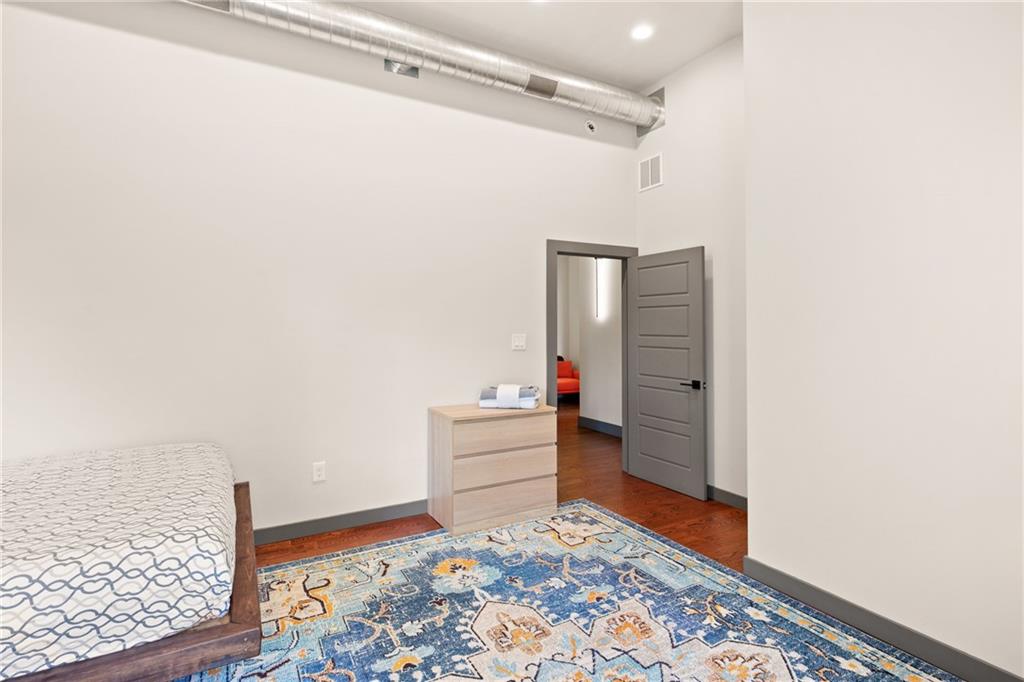 146 Luna Way Markleton, PA 15551 - Photo 29 of 50 a room with a baby crib and a wooden floor