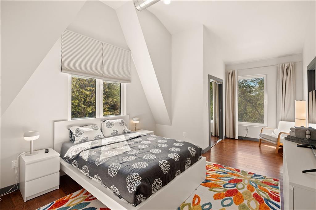 146 Luna Way Markleton, PA 15551 - Photo 34 of 50 a bedroom with a bed a large window with wooden floor