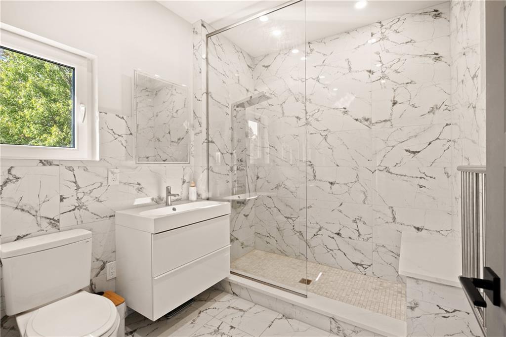 146 Luna Way Markleton, PA 15551 - Photo 36 of 50 a bathroom with a sink toilet and shower