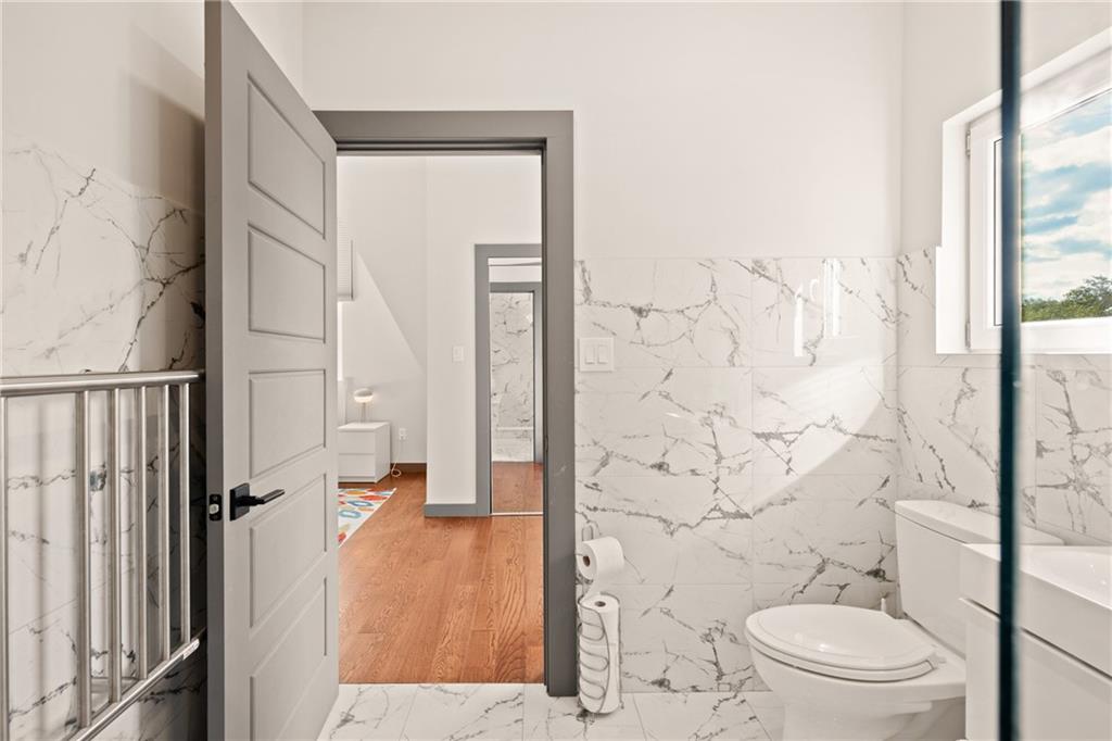 146 Luna Way Markleton, PA 15551 - Photo 38 of 50 a bathroom with a toilet a sink and shower