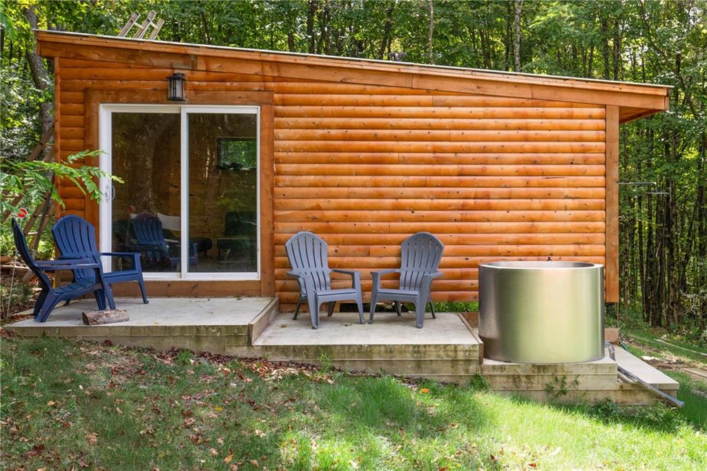 146 Luna Way Markleton, PA 15551 - Photo 44 of 50 a view of a patio with table and chairs and potted plants