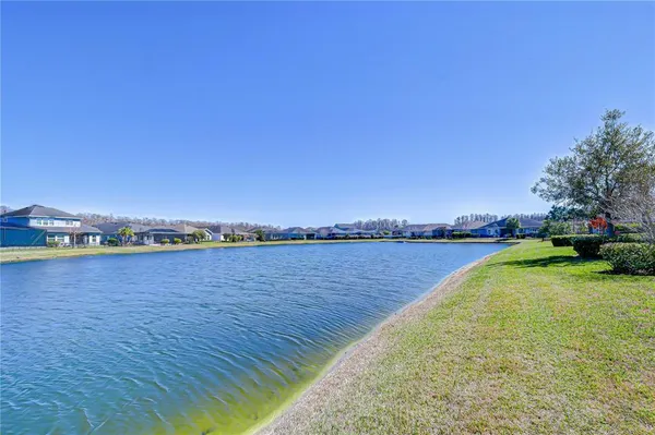 a view of a house with yard and ocean view