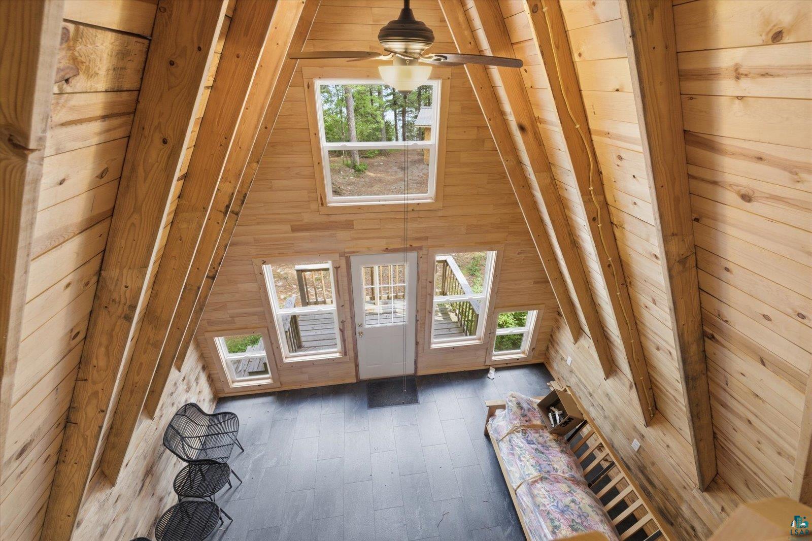 5298 Long Island Tower, MN 55790 - Photo 16 of 31 A-frame interior featuring natural wood plank walls and exposed wood beams