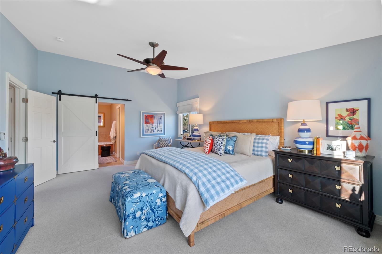 145 Willowleaf Drive Littleton, CO 80127 - Photo 24 of 42 a bedroom with a bed and dresser