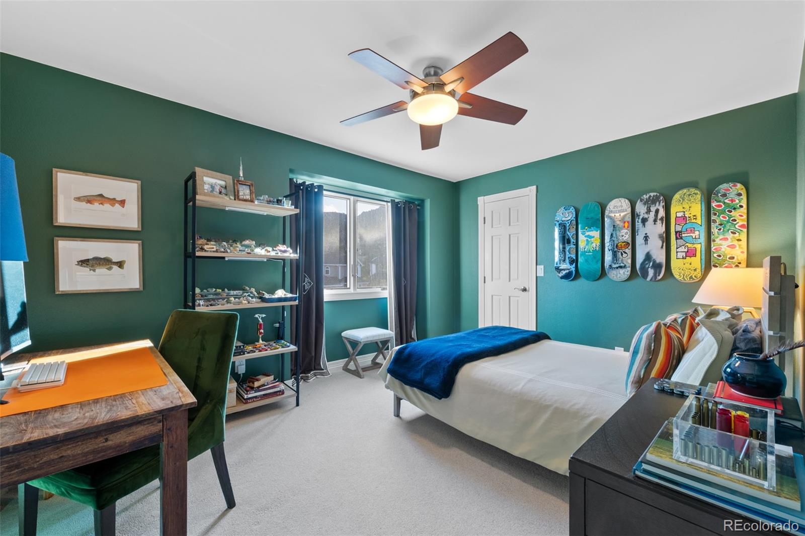 145 Willowleaf Drive Littleton, CO 80127 - Photo 27 of 42 a bedroom with a bed window and a chair